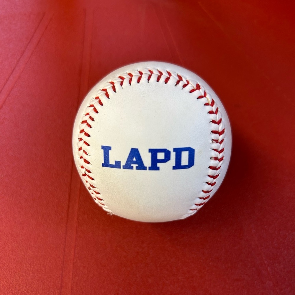 White Baseball with Red Stitching